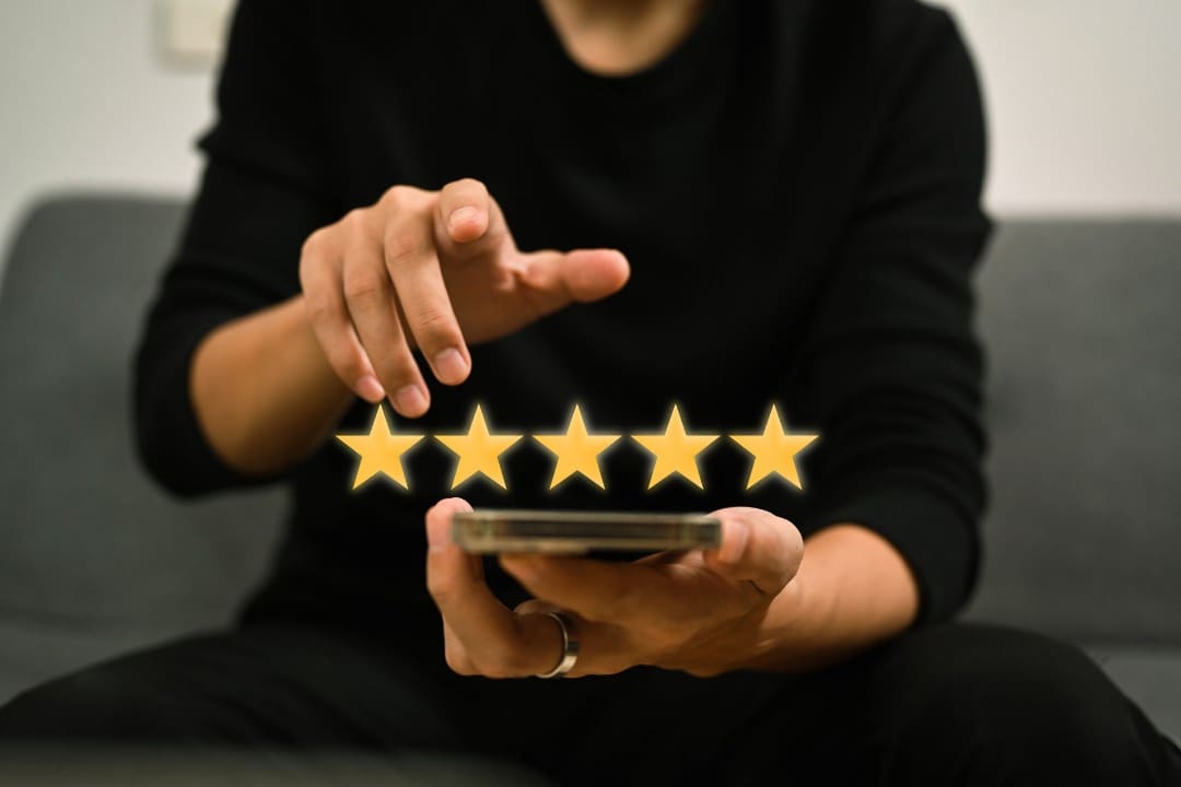 Man giving a five-star review.