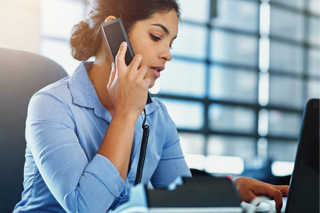 Female Medicare insurance agent following up with leads